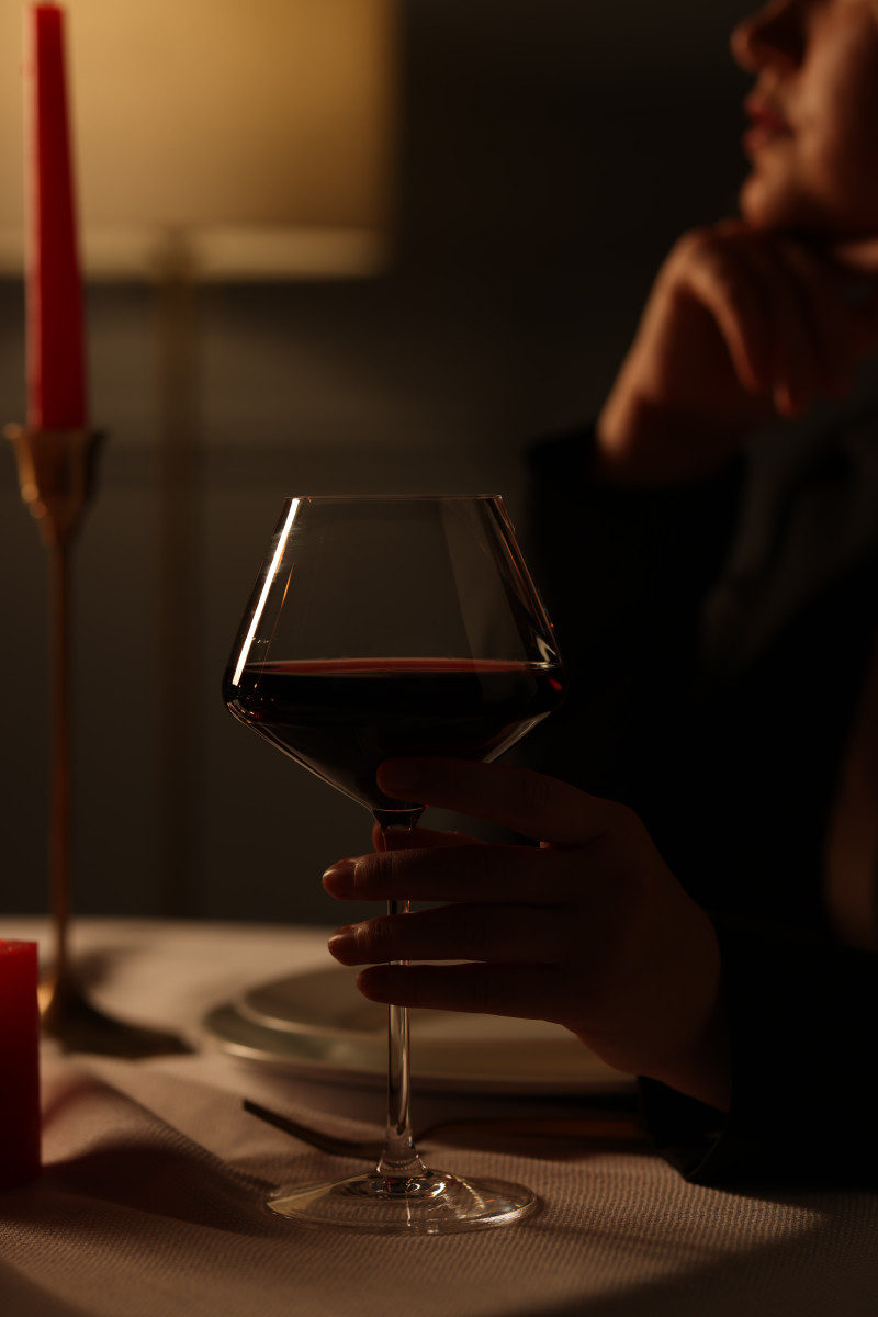 beautiful young woman with glass wine table restaurant closeup